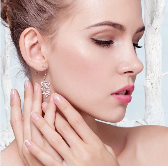 Women's 925 silver stud earrings with a simple, elegant design, showcasing shiny silver metal and secure post backs.