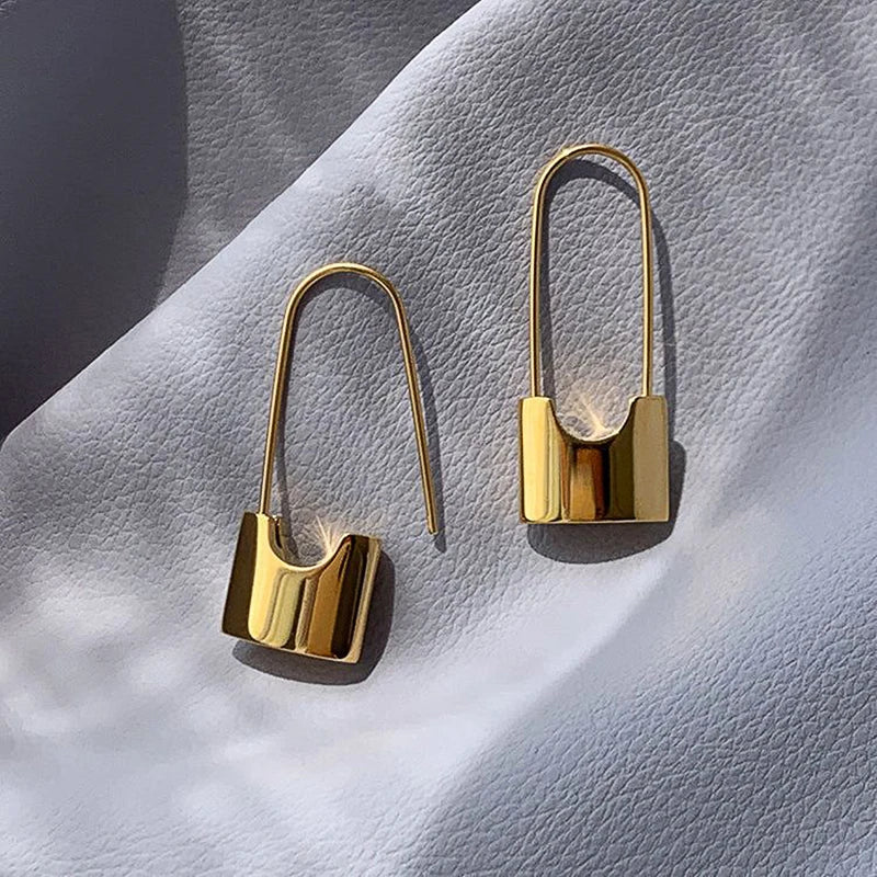 Metallic hip hop lock earrings for women, stylish piercing jewelry with a cool, everyday metallic style accessory design.