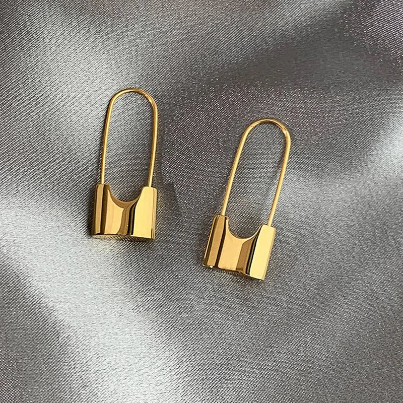 Metallic hip hop lock earrings for women, stylish piercing jewelry with a cool, everyday wear design.