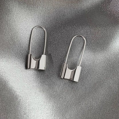 Metallic hip-hop lock earrings for women, stylish piercing jewelry with a cool, daily-wear design in a hip-hop style.