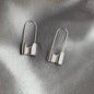 Metallic hip-hop lock earrings for women, stylish piercing jewelry with a cool, daily-wear design in a hip-hop style.