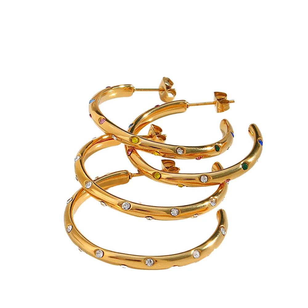 Sterling silver girls' huggie hoop earrings with gold plating and zircon stones, trendy wedding jewelry featuring a round design.