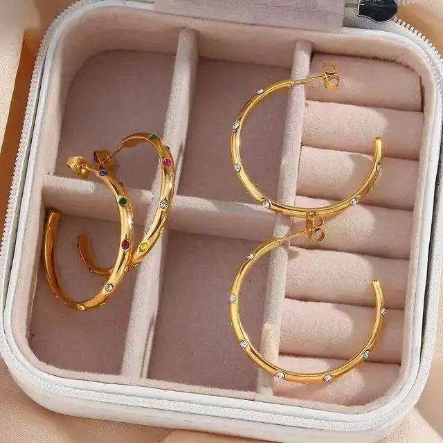 Sterling silver girls huggie hoop earrings with gold plating and zircon accents, trendy jewelry for weddings and special occasions.