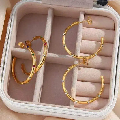 Sterling silver girls huggie hoop earrings with gold plating and zircon accents, trendy jewelry for weddings and special occasions.