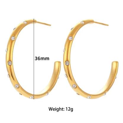 Sterling silver huggie hoop earrings with gold plating and zircon accents, stylish trendy jewelry for girls and special occasions.