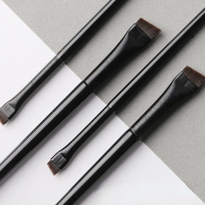 Professional makeup brushes for women, including eyeliner, eyebrow, and contour brushes with flat fine blades for precise application.