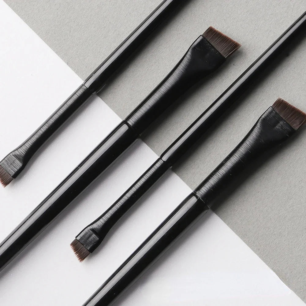 Professional makeup brushes for women, including eyebrow, eyeliner, and contour brushes, with flat fine blades for precise application.