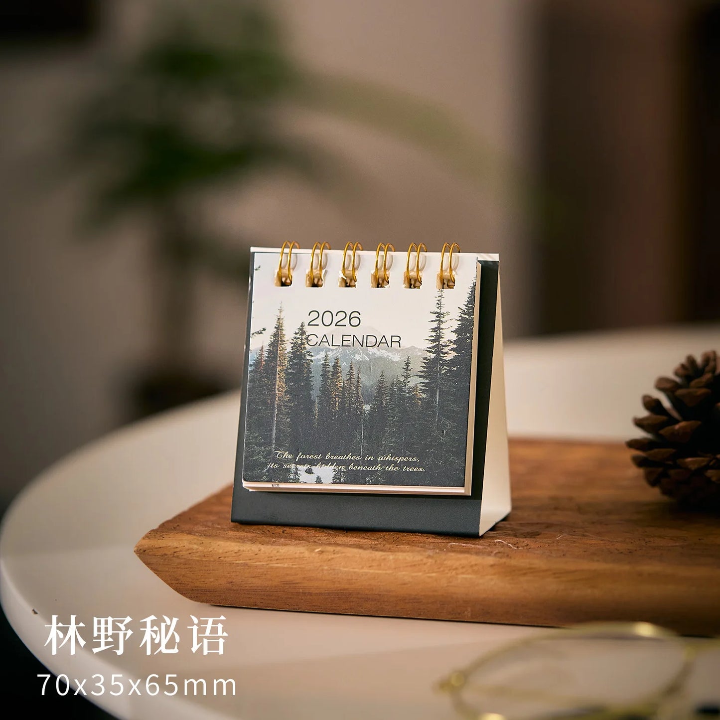 Simple Mini 2026 desk calendar by BackupMyFilesNow.com, featuring monthly planner and office supplies for organized workspace.