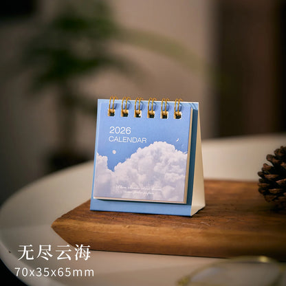 Simple Mini 2026 calendar from BackupMyFilesNow.com, a compact desk planner for office or school use with decorative desk accessories.