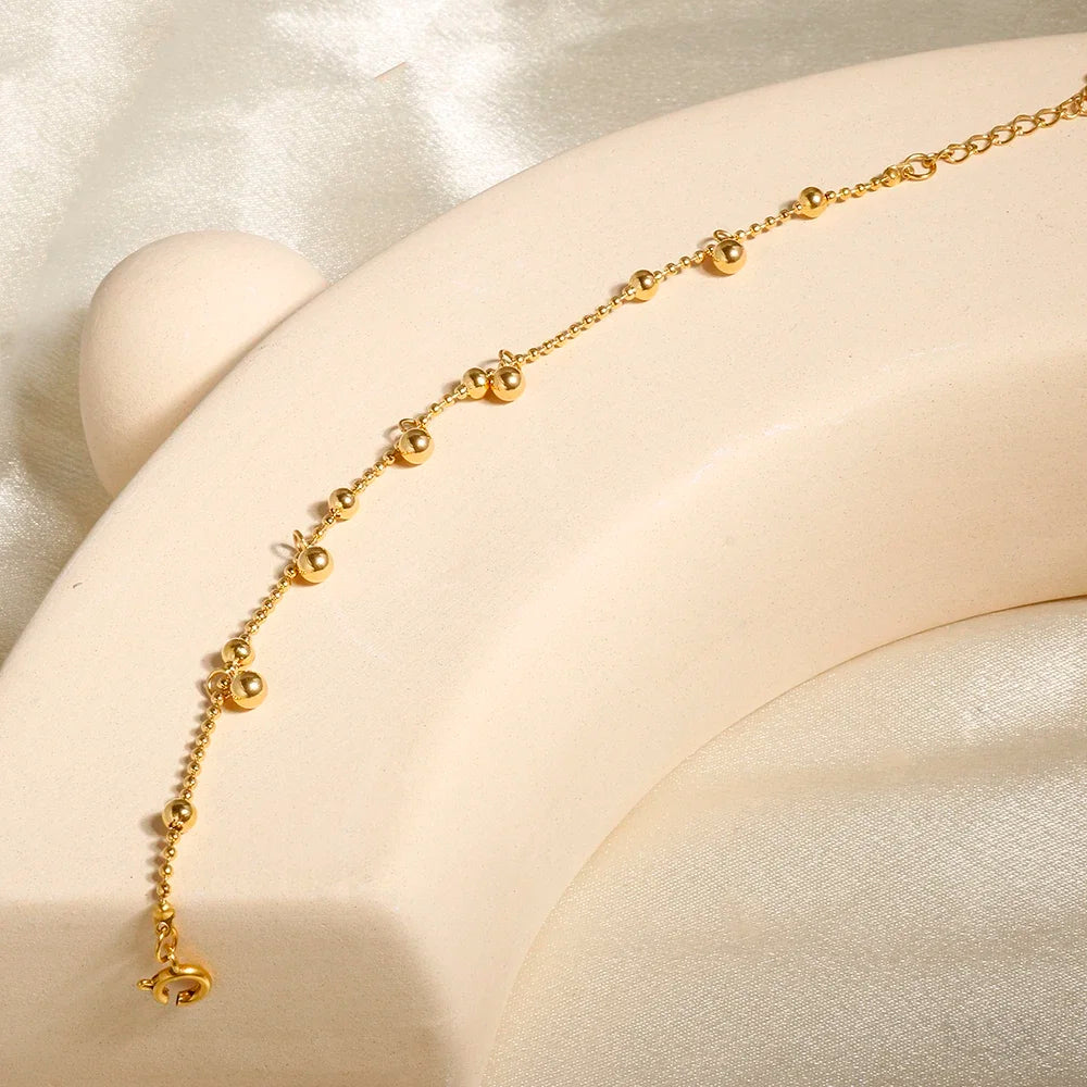Stainless steel bohemian-style personalized anklet with intricate bead and charm details, ideal for summer or casual wear.