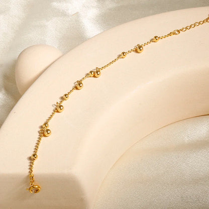 Stainless steel bohemian-style personalized anklet with intricate bead and charm details, ideal for summer or casual wear.
