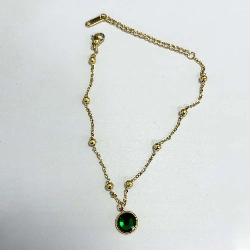 Stainless steel bohemian-style personalized anklet with intricate charms and adjustable chain design.