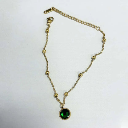 Stainless steel bohemian-style personalized anklet with intricate charms and adjustable chain design.