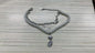 Stainless steel bohemian style personalized anklet with intricate design and adjustable chain on a neutral background.