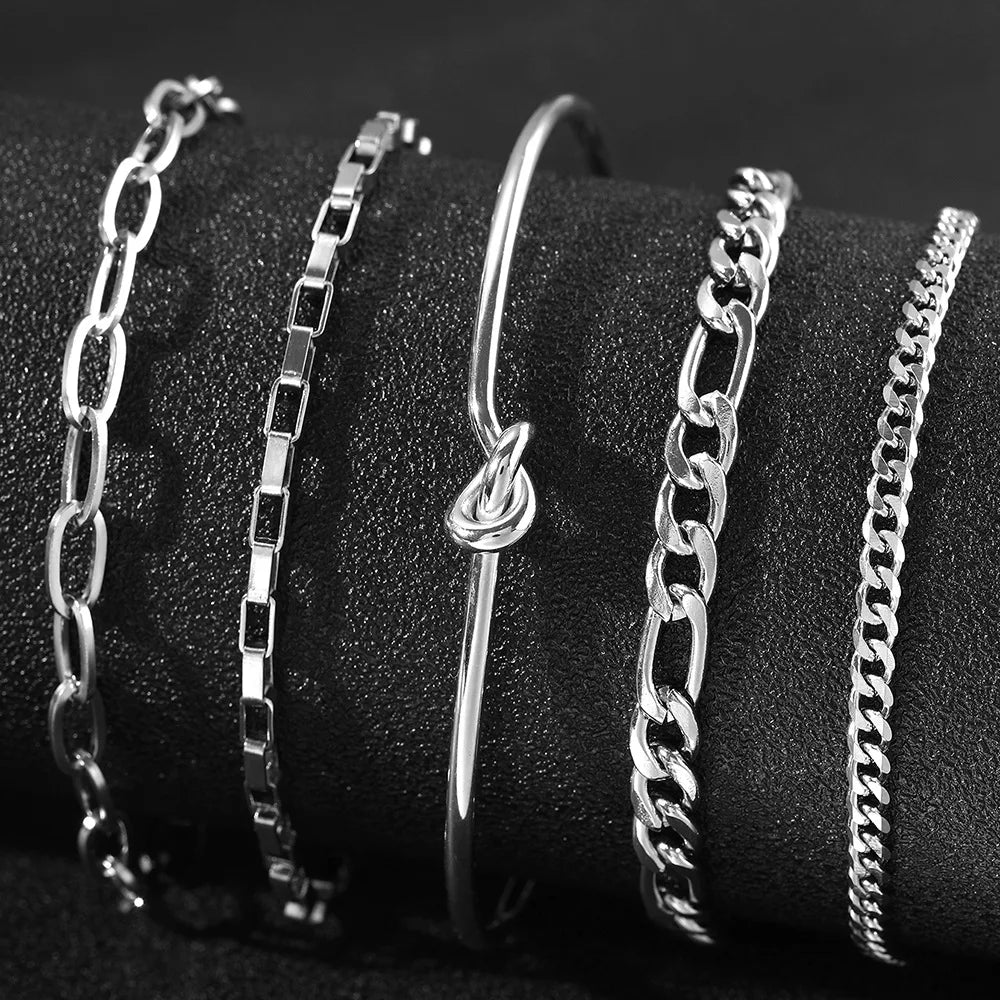 Stainless steel Bohemian style personalized anklet with intricate design and adjustable chain on a white background.