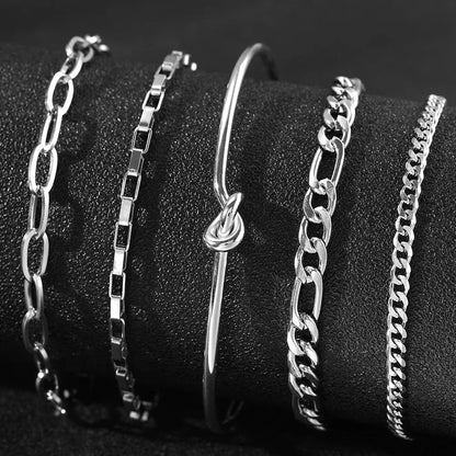 Stainless steel Bohemian style personalized anklet with intricate design and adjustable chain on a white background.