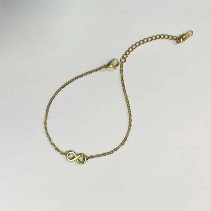 Stainless steel bohemian style personalized anklet with intricate charms, ideal for casual and boho fashion looks.