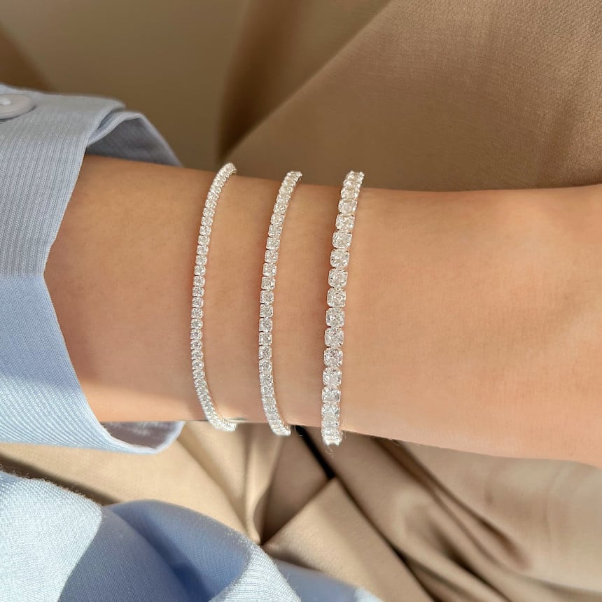 Simple 925 sterling silver zircon diamond bracelet with delicate design, showcasing sparkling stones and polished silver finish.