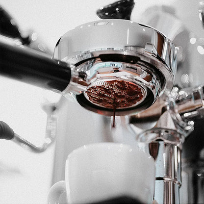 Gaggia 58mm bottomless portafilter with solid wood handle, universal filter holder for Gaggia Classic espresso machines.
