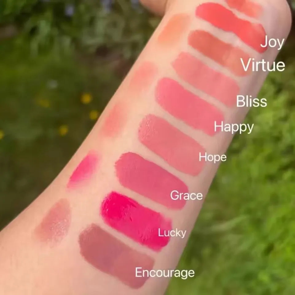 Rare Beauty liquid blush in a natural, long-lasting muddy pink shade, featuring glossy, moisturized cheek application.