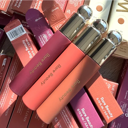 Rare Beauty liquid blush and cream cheek rouge with natural, long-lasting muddy pink color and glossy, moisturizing finish.