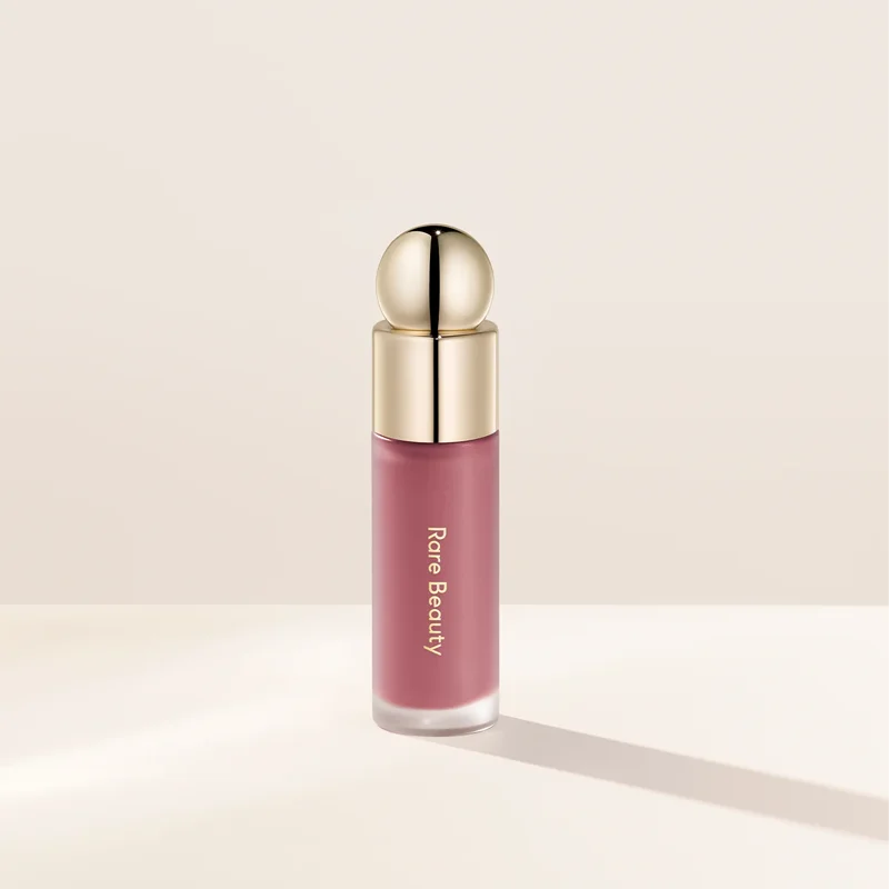 Rare Beauty liquid blush in natural, long-lasting muddy shade, featuring a glossy, moisturizing cream formula for cheeks.