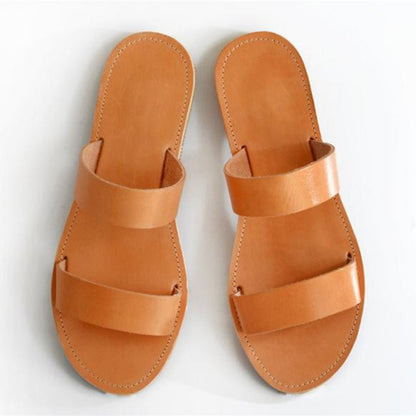 Open-toe flat sandals and slippers from BACKUPMYFILESNOW.COM®, featuring a simple design and comfortable slip-on style.