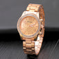 Gold Geneva Classic stainless steel women's quartz watch with a sleek round face and elegant design.