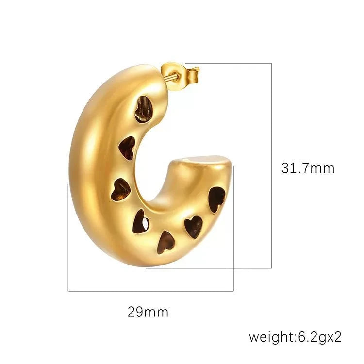 Gold-plated stainless steel hollow heart earrings with vintage C-shape design, polished finish, suitable for women.
