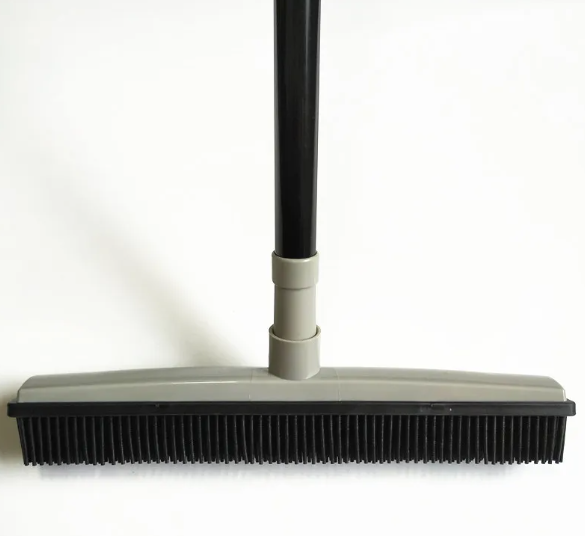 Grass green pet hair removal broom mop by BackupMyFilesNow.com shown with bristles designed for effective pet hair cleanup.