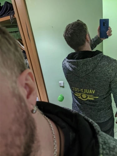 Gray SpaceX hoodie featuring Space X logo and NASA design, men's zip-up jacket with hood, casual outerwear for fans.