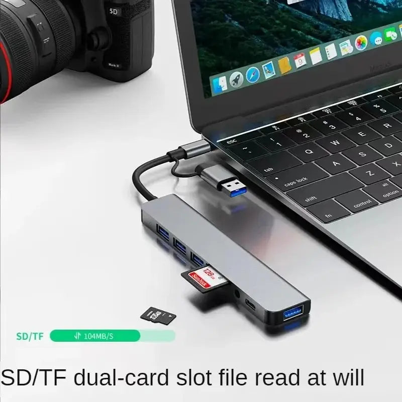 Gray 8-in-2 USB hub with USB-C port, SD and TF card reader, and multiple USB 3.0/2.0 ports for device expansion.