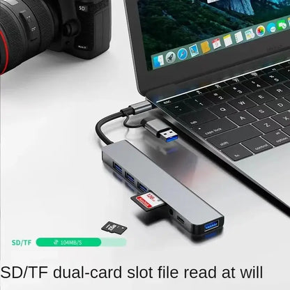 Gray 8-in-2 USB hub with USB-C port, SD and TF card reader, and multiple USB 3.0/2.0 ports for device expansion.