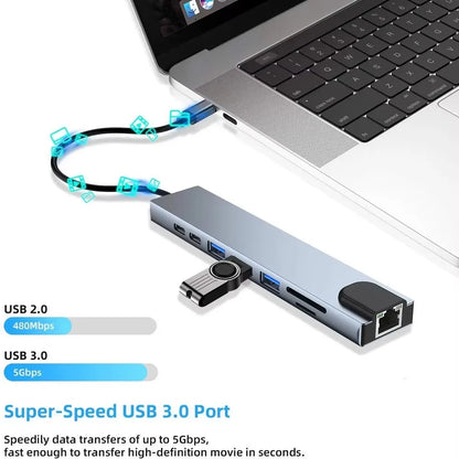 Gray USB 3.0 Type C hub with HDMI 4K, Ethernet, VGA, headphone port, and Power Delivery 100W for versatile device connectivity.