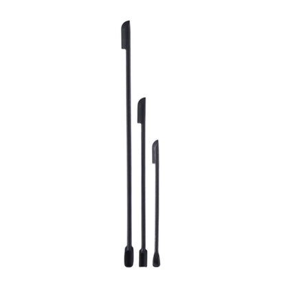 Green silicone face mask brush and spatula set for cosmetics and skincare, with deep bottle scraper and makeup application tools.