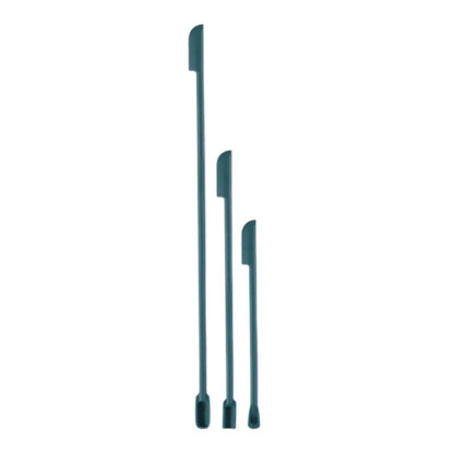 Green silicone face mask brush and spatula set with deep bottle scraper and makeup brushes for cosmetics application.