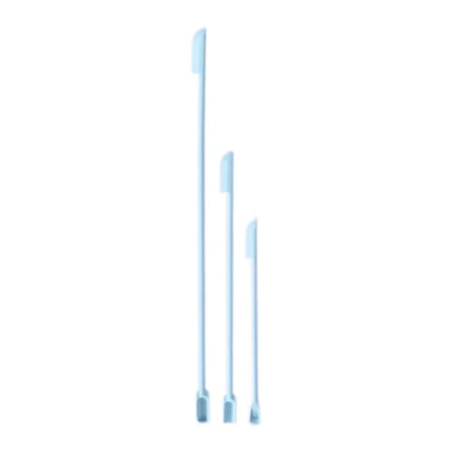 Green silicone face mask brush and spatula set with makeup brushes and cosmetics spoon for skincare and beauty application.