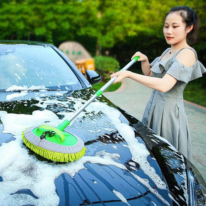 Green car cleaning brush with adjustable telescoping handle and soft absorbent bristles for detailing and auto wash.