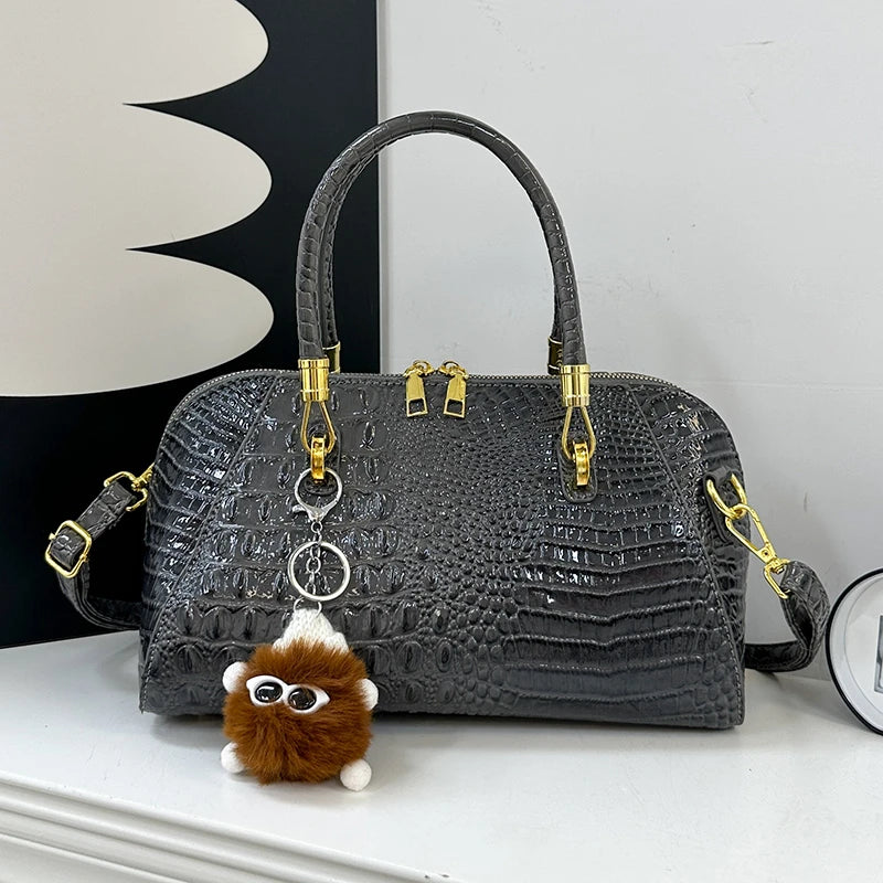 Black crocodile leather women's handbag with shoulder strap, classic crossbody design, luxurious designer fashion bag.