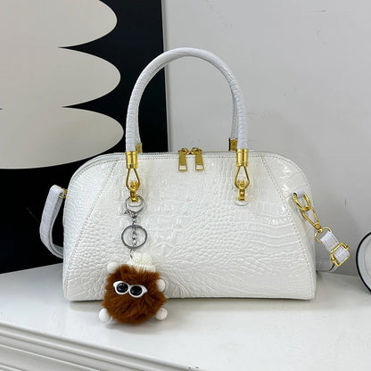 Black crocodile leather shoulder handbag for women, stylish designer crossbody bag with luxury finish and classic design.