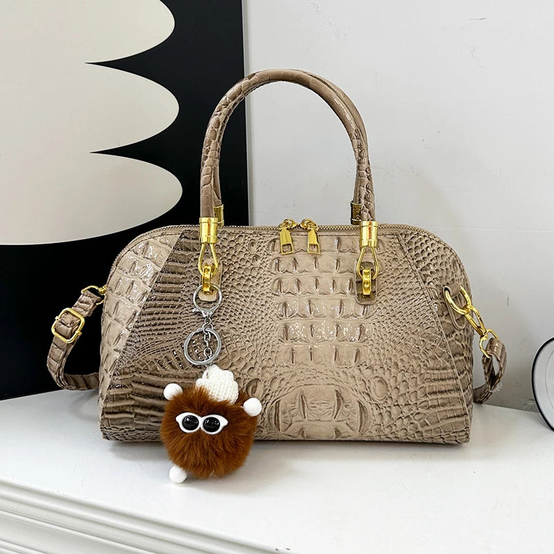 Black crocodile leather shoulder handbag for women, luxury designer crossbody bag with classic style and spacious interior.
