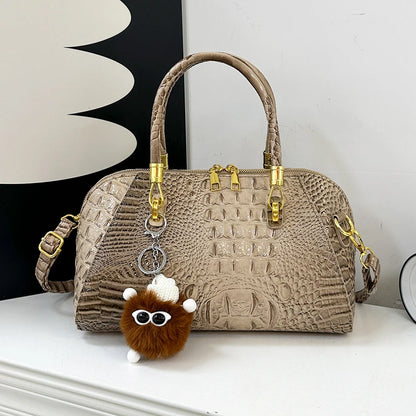 Black crocodile leather shoulder handbag for women, luxury designer crossbody bag with classic style and spacious interior.