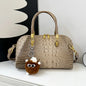 Black crocodile leather shoulder handbag for women, luxury designer crossbody bag with classic style and spacious interior.