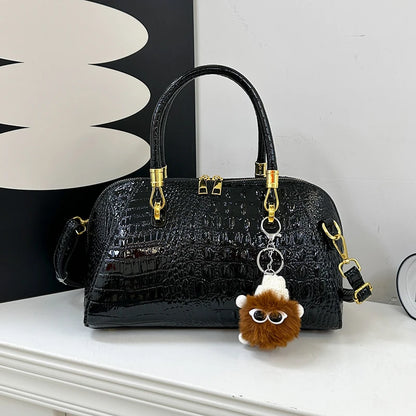 Black crocodile leather women's handbag with shoulder strap, designer crossbody bag for women, luxury fashion accessory.