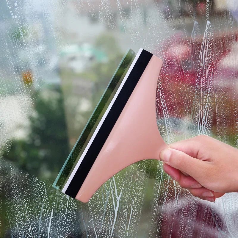 Green soft silicone glass scraper and squeegee cleaner for car mirrors, windows, showers, and bathroom or kitchen surfaces.