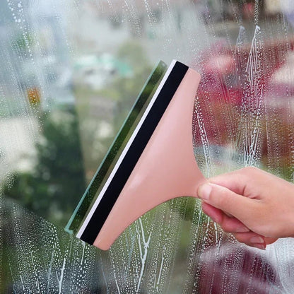 Green soft silicone glass scraper and squeegee cleaner for car mirrors, windows, showers, and bathroom or kitchen surfaces.