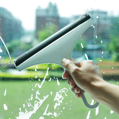Green soft silicone glass scraper and squeegee cleaner for car mirrors, windows, shower, and bathroom surfaces.
