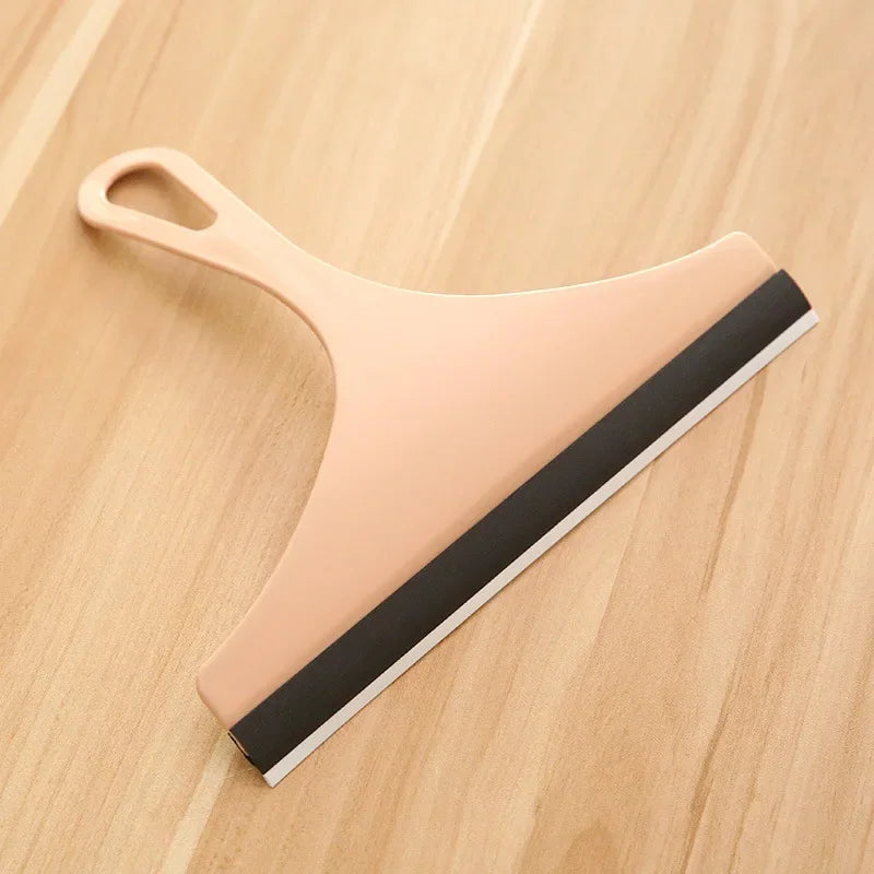 Green silicone glass scraper and squeegee for car mirrors, windows, shower, and bathroom cleaning with brush holder.