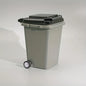 Grey portable mini office desk trash bin and pen holder for office supplies storage, compact and convenient for workspace organization.