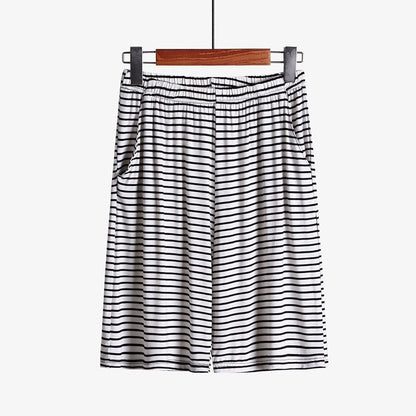 Plus size striped loose-fitting loungewear shorts in soft fabric, featuring a comfortable elastic waistband.